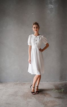 "This design linen dress is perfect for summer and fall! 100 % designed and handmade by Emsilk. I am pleased to offer your garments made to measure at no extra cost. * Detail: - Collared neckline - Coconut buttons on the front - Small gathered decoration on the front - Fit and flare bottom - Fully lined - Invisible zipper on the back - Below the knee length - High quality linen, washed linen, soft linen - The model is 5'6\" tall and wearing size S. * Care: - Dry clean or machine washed with cold Linen Summer Dress, Dress With Collar, Linen Summer, Summer Linen Dresses, Dress Linen, Dress Short Sleeve, Puffed Sleeves, Tea Dress, Dress Short