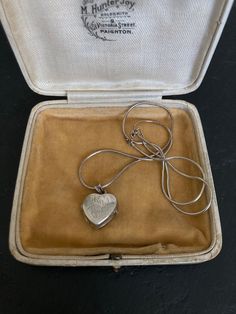 Beautiful 1970s VINTAGE SILVER Locket on a sterling silver 16 inch Chain. A lovely heart shaped Sterling Silver Engraved Pendant Necklace. 70s Vintage Silver Jewelry offered by Isobel Vintage Jewels on Etsy Style: Vintage 1970s real silver locket. A lovely heart 70s side opening sterling silver locket big enough for putting little photos inside.  Colour: silver  Size: 1.5 x 1.5 cm and 16 inch chain Condition: Excellent condition Approximate Date: 1970s Check out my other lovely silver items including this one: https://www.etsy.com/uk/listing/1269638336/70s-sterling-silver-ring-pretty-delicate Please note: ALL the items in my shop are vintage and have been previously worn. Items will show wear commensurate with their age and any major flaws will be noted and I really only sell items that ar Vintage Hallmarked White Gold Locket Necklace, Vintage White Gold Locket Necklace Gift, Vintage White Gold Locket Necklace For Gift, Vintage White Gold Locket Necklace As A Gift, Vintage Open Heart Engraved Locket Necklace, Vintage Engraved Open Heart Locket Necklace, Vintage Open Heart Keepsake Jewelry, Vintage Locket Necklace With Heart Charm For Anniversary, Vintage Sterling Silver Jewelry For Valentine's Day