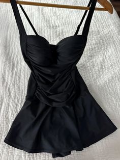 Venus St. Tropez Swim Dress Black Size 8 This elegant swim dress is ready for its moment in the sun, and it's deserving considering how unbelievably flattering it is. Its little secret: a control lining that offers mid-level shaping support. With a sweetheart neckline, ruched middle and feminine skirt that provides flirty coverage, this one-piece will easily become your new fave. Control lining Adjustable straps Molded cups Full coverage skirt Domestic or import of quality nylon/spandex tricot Only worn a few times, in lovely condition with no tears or pulls. From a smoke free home and washed in delicate detergent and ready to wear :) This item is still for sale on the Venus web site for $59.90 with out tax or shipping costs. I love it but it a little to tight in the top for me. I do have Feminine Skirt, Swimwear Dress, St Tropez, Swim Dress, Women Swimsuits, Sweetheart Neckline, Dress Black, Bathing Suits, Adjustable Straps