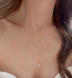 * DETAILS * (The drop on the necklace is 3 inches.) * Gold Plated Necklace  -Teardrop Shape Synthetic White Pearls - 18K Gold Plated Dainty Cable Chain - Gold plated CZ Paved Connector - 14k Gold Filled Spring Ring Clasp  👉🏻For more Y-necklaces, see https://www.etsy.com/shop/JinnysJewelryBySeJin * CARE TIPS * ⭐️TO PREVENT TARNISH: Keep your jewellery in airtight plastic bags. It won't tarnish if it isn't exposed to air. The worst place to leave your jewellery is in a steamy bathroom. Wipe with Dainty Pear-shaped Drop Necklace For Formal Events, Elegant Dangle Drop Necklace For Anniversary, Elegant Teardrop Backdrop Necklace With Adjustable Fit, White Drop Necklace With Delicate Dangle Chain, White Drop Lariat Necklace With Pearl Drop, Elegant Adjustable Teardrop Drop Necklace, White Teardrop Pendant Drop Necklace With Adjustable Chain, Elegant Teardrop Pendant Lariat Necklace For Wedding, White Delicate Dangle Drop Necklace