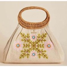 Welcome The Bright And Sunny Season With This Floral And Vine Embroidered Accessory. Details : Embroidered Jute/ Cotton With Soft, Durable Top Grain Leather Accents Woven Handle : W: 14.5in H: 10in D: 5in Handle Diameter: 3.25in Embroidered Natural Tote Shoulder Bag, Embroidered Beige Tote Shoulder Bag, Natural Embroidered Tote Bag, Natural Color Embroidered Tote Bag, Embroidered Beige Satchel For Everyday Use, Embroidered Beige Tote Bag, Everyday Embroidered Cream Bag, Top Handle Bags With Floral Embroidery For Everyday, Everyday Top Handle Bag With Floral Embroidery