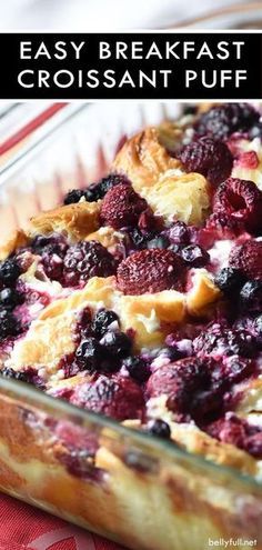 an easy breakfast croissant puff is in a glass dish on a red and white tablecloth