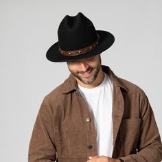 Features: Brim Size: 2.75" 100% wool Size: Men's s/m: 58cm, l/xl: 60cm Wool felt cowboy hat with embossed faux leather trim and studs Leather Felt Hat For Western-themed Winter Events, Western Style Leather Felt Hat For Winter, Winter Western Leather Felt Hat, Western Leather Felt Hat With Short Brim, Leather Felt Hat With Flat Brim For Fall, Leather Wide Brim Felt Hat For Fall, Leather Fedora For Country Events, Leather Brimmed Felt Hat For Western-themed Events, Leather Hats For Ranch In Winter