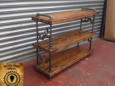 two wooden shelves sitting next to each other in front of a building