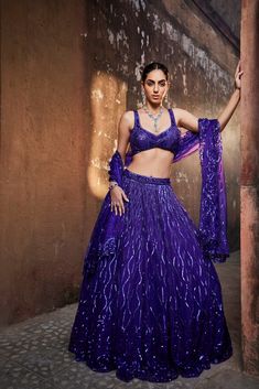 Bright purple embroidered choli, lehenga and dupatta set. In this exquisite set, you'll be draped in luxurious bright purple fabric and adorned with intricate embroidery. Look and feel like a regal work of art. Color : Bright purple FIT : Relaxed Fabric Composition : Net and Organza No. of pieces : 3 Delivery Time : 21 days Purple Lehenga, Electric Purple, Purple Fits, Red Y, Traditional Indian Outfits, Pop Up Event, Dupatta Set, Purple Fabric, Bright Purple