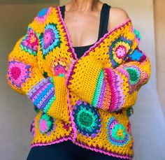 - Only 1 available, ready to ship - Every granny square is different and unique - Size M/L (length 61cm/24in, width armpit to armpit 67cm/26.4in, sleeve width 20cm/7.9in) - Oversized fit - Open front/no closure - Many colorful details  - Soft and cozy - Machine washable in cold temperature 30*C If you have any questions please contact me:) Handmade Bohemian Patterns For Festival, Handmade Multicolor Patterns For Festival, Handmade Bohemian Patterns For Spring, Bohemian Multicolor Patterns For Crafting, Multicolor Bohemian Patterns For Crafting, Festival Crochet Patterns In Multicolor, Bohemian Granny Square Patterns For Spring, Handmade Multicolor Cardigan For Festival, Spring Bohemian Knitting Patterns