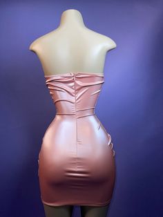 Strapless rose gold / dusty rose corset dress with drapes and cinches all around. Has wiring in the corset. Pink Strapless Corset Party Dress, Party Corset With Pleated Fitted Bodice, Strapless Pink Corset Dress For Party, Pink Strapless Corset Dress For Party, Strapless Ruched Bodice Corset For Night Out, Pink Strapless Corset Dress For Evening, Party Dress With Ruched Bodice And Overbust Shape, Party Dresses With Ruched Bodice Overbust, Pink Strapless Dress With Pleated Bodice For Party