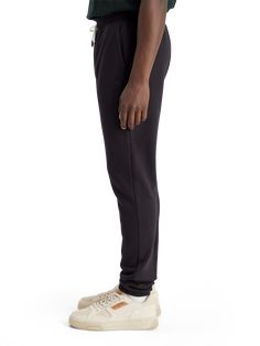 Elevate your casual look with our Essential Logo Sweatpants. Made from 100% cotton, these sweatpants feature a classic closed bottom with elastic around the hem to maintain a snug fit at your ankles and legs. Whether you're hitting the gym or relaxing at home, these sweatpants provide both comfort and style. 100% Cotton Wash - 30 Degrees Normal Logo Sweatpants, Essentials Logo, Casual Look, Snug Fit, The Gym, Casual Looks, Sweatpants, Gym, Elastic