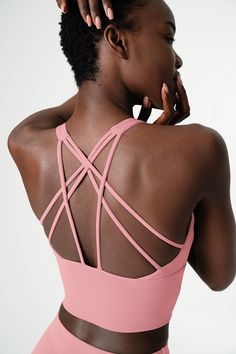 Keep your look top-notch and your performance A+ with our sleek Dusty Pink top. Designed with a classic scoopneck and a bold multi-crisscross back design, this strappy, fully-lined bra will have your back for various activities. It features a flattering long-line silhouette with removable cups for an optional shape. High-quality, breathable fabric feels lightweight and super soft to the touch. This versatile sports bra allows a great support with a nice 4-way stretch for your durable wear. Perfe Strappy Activewear With Built-in Bra And Stretch, Moisture-wicking Stretch Sports Bra With Strappy Design, Breathable Fitted Strappy Activewear, Fitted Breathable Strappy Activewear, Fitted Strappy Moisture-wicking Activewear, Strappy Stretch Athleisure Activewear, High Stretch Strappy Activewear For Workout, Stretch Crisscross Sports Bra, High Stretch Strappy Activewear Athleisure