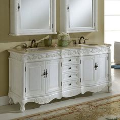 a white double sink vanity with two mirrors