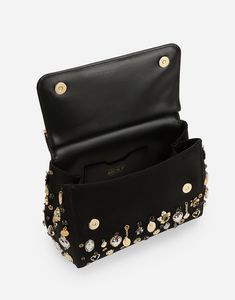 Medium satin Sicily handbag with embroidered charms: Black Front flap with hidden double magnetic fastening Branded tag featuring two metal plating finishes Top handle and adjustable, detachable strap in calfskin Calfskin lining Inner pocket with branded zipper and a cell phone holder Item comes with a branded dust bag Measurements: H18.5 x W20 x D10 cm Made in Italy Designer Evening Shoulder Bag With Metal Hardware, Luxury Crossbody Evening Bag With Metal Hardware, Party Leather Shoulder Bag With Branded Hardware, Luxury Evening Clutch With Branded Hardware, Leather Shoulder Bag With Branded Hardware For Party, Luxury Clutch Satchel As Fashion Accessory, Embellished Leather Party Bag, Black Embellished Top Handle Bag, Gold Party Bag With Branded Hardware