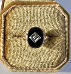 Classic vintage circa 1940s retro era 10k gold genuine onyx & diamond ring! This lovely statement ring contains a genuine black onyx gemstone, set with genuine 0.03 CT diamond set in 10k gold. A beautiful piece of fine 1940s era jewelry! ERA - Circa 1940s / Retro METAL / MATERIAL - 10k gold, genuine onyx, genuine diamond (approx. 0.03 ct) MARKINGS / HISTORY - Inside of band is marked 10k and makers mark CONDITION - Good vintage condition. White gold metal has been cleaned some patina remaining . Antique Signet Ring With Diamond Accents For Formal, Antique Signet Ring With Diamond Accents For Formal Occasions, Vintage 14k Stamped Diamond Jewelry, Retro Formal Rings With Polished Finish, Retro Rings With Polished Finish For Formal Occasions, Vintage Round Signet Ring For Formal Occasions, Vintage Jewelry With Diamond Accents, Retro Polished Rings For Formal Events, Vintage 14k Stamped Oval Diamond Ring