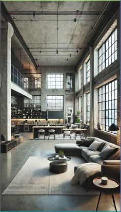 an industrial living room with large windows and lots of furniture