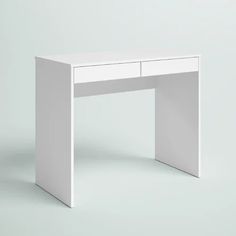 a white desk with two drawers on the top and one drawer at the bottom, against a gray background