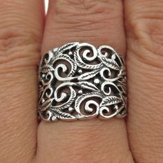 Great vintage condition.  925 Sterling Silver Vintage Ornate Wide Ring Size 7.75  Weight: 6.5g   WELCOME TO PAWN SHOP We are an actual pawn shop and have been in business for over 25 years. Since 1990, our establishment has been serving a variety of clients by providing them with short term cash solutions and options of liquidity regarding their treasured heirlooms. Acknowledging that today′s customers are very sophisticated and are looking for a variety of investments, our acquisitions are hand Vintage Wide Band Ring With Intricate Design, Vintage Ring With Wide Band And Intricate Design, Vintage Ring With Intricate Design And Wide Band, Vintage Wide Band Jewelry With Intricate Design, Vintage Wide Band Jewelry For Anniversary, Vintage Sterling Silver Wide Band Jewelry, Vintage Sterling Silver Open Filigree Ring, Vintage Antique Silver Rings Stamped 925, Vintage Silver Wide Band Jewelry