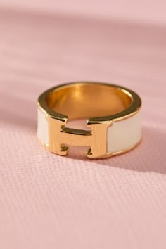 This elegant H enamel band ring is a stylish and effortless accessory to spice up your look. The ring's sleek, minimalist design features a single band of vibrant enamel. This versatile ring is perfect for everyday wear and it makes a great gift for anyone who appreciates timeless elegance and modern design. Christmas List Items 2024, My Christmas Wishlist Gift Ideas, White Enamel Ring, Rings And Bracelets Aesthetic, Ring Inspo Jewelry, Senior Ring, Chunky Gold Rings, Enamel Rings, Ring Stacks