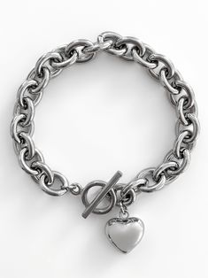 The bracelet guaranteed to make your heart skip a beat - prepare to fall in love! Featuring an adorable, smooth puffed heart pendant paired alongside stainless steel chain, the 'BE MINE' is the guaranteed to receive a lot of love. Wear this piece on its own, or pair with our 'LUV U' suede wrap choker for the sweetest look! Made with stainless steel chain and pendants. Waterproof & rust-free. Available in lengths 6", 7", 8", 9". Model is wearing 6". Handmade with love in Los Angeles. Puffed Heart, Toggle Bracelet, Creating Jewelry, Be Mine, Steel Chain, Stainless Steel Chain, Handmade With Love, Heart Pendant, Fall In Love