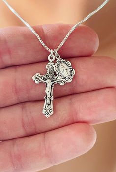 "This is a 925 sterling silver Italian style crucifix cross pendant alongside a 925 sterling silver Mother Mary miraculous medallion.  Both pendants come together on a 925 sterling silver 1mm box chain. This is an incredible piece of heirloom jewelry for women!  These gorgeous charms are made by master silversmiths here in the USA.  Such attention to detail these charms are so exquisite that the photos do not do them justice!  Silver cross is matte and silver shiny silver, measures 28x17mm.  Miraculous medal measures 12x8mm and is stamped with Mother Mary seal on backside. This necklace chain is available in different lengths. Comes in a gift box ready to present. Model has a small neck, is wearing the 16\" length. This necklace is also available in Gold (14k gold filled box chain with 16k Crucifix Necklace Silver, Catholic Jewelry Silver, Silver Virgin Mary Necklace, Mexican Jewelry Silver, Small Silver Cross Necklace, Vintage Catholic Jewelry, Silver Crucifix Necklace, Unique Cross Necklace, Sterling Silver Crucifix Necklace