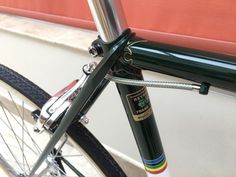 a close up view of the front end of a bike with a bar on it