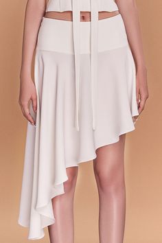 This luxurious piece features a unique asymmetrical design and is made of high-quality crepe fabric, draping elegantly to flatter your curves. Perfect for a day at the office or a night out, it's a must-have addition to your wardrobe. Length: 35cm (Shortest), 81cm (Longest) Chic Asymmetrical Draped Skirt For Work, Pre-draped Asymmetrical Skirt For Spring, Chic Draped Skirt For Work, Feminine Asymmetrical Cocktail Dress, Elegant Wrap Skirt With Asymmetrical Hem For Work, Asymmetrical Bottoms For Formal Spring Occasions, Asymmetrical Bottoms For Spring Formal Events, Asymmetrical Bottoms For Spring Formal Occasions, Spring Formal Asymmetrical Bottoms