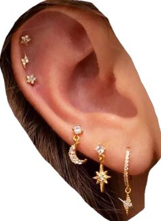 a woman's ear with three different piercings