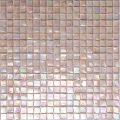 a close up view of a glass mosaic tile wall with white and pink squares on it