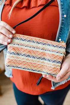 Your favorite clutch is in a whole new pattern and material for summer! So many pockets and room to hold all of your essentials! It has a zip closure, detachable wrist or shoulder strap that can be worn on the shoulder or crossbody, and supple faux leather. The gorgeous strawberry, mint, navy, andnatural colors are amazingly woven together in a fun pattern. Measurements Measurements: 9" long x 5” tall x 1.5” deep Shipping Free standard shipping on all orders of $150 or more! Free In-store Pick-u Trendy Clutch With Zipper Closure For On-the-go, Trendy On-the-go Clutch With Zipper Closure, Travel Pouch For Spring, Summer Cosmetic Pouch With Zipper, Trendy Clutch With Zipper Pocket, Trendy Clutch With Zipper Closure For Travel, Trendy Pouch Clutch With Zipper Pocket, Trendy Travel Clutch With Zipper Closure, Casual Wallet With Zipper Pouch