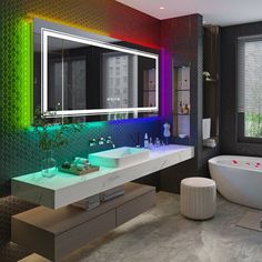 a bathroom with two sinks, a tub and a large mirror on the wall above it