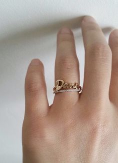 // FREE SHIPPING within U.S. // This 14k solid gold Skinny Name Ring is simply elegant. Gracefully wrap your or your loved ones name around your finger. Available in 14k yellow, white or rose gold. Makes a beautiful modern wedding ring; its simplicity also makes a lovely anniversary ring or push present for stacking with other rings. DETAILS: - First letter measures approximately 7mm - Lowercase letters measure approximately 3.5mm - Bottom shank measures 1.25mm Please write the name of your choi Modern Wedding Ring, Mrs Ring, Modern Wedding Rings, Push Present, Personalized Wedding Rings, Name Ring, Monogram Ring, Name Rings, Ring Wedding Band