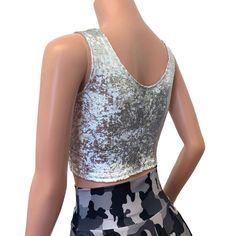 The perfect crop tank top for your rave or festival outfit. This top is made of 4-way stretch white with silver gilded metallic velvet. Top fit snug to the body and sits above the belly button. Fitted Sleeveless Disco Top, Stretch Tank Crop Top For Party, Silver Fitted Tank Top For Party Season, Fitted Tank Top For Party Season, Silver Sleeveless Tank Top For Club, Sleeveless Silver Crop Top For Club, Fitted Shimmer Crop Top For Night Out, Sleeveless Sequined Crop Top For Club, Fitted Silver Sleeveless Crop Top