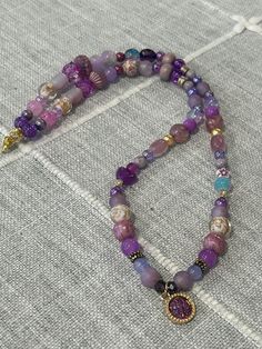 23 inches end to end, pendant .5 inch Purple Single Strand Bohemian Beaded Necklace, Bohemian Purple Single Strand Beaded Necklace, Beaded Round Pendant Necklaces For Healing, Purple Beaded Chain Necklace With Round Beads, Spiritual Single Strand Purple Beaded Necklace, Spiritual Beaded Chain Necklace With Round Pendant, Spiritual Necklace With Beaded Chain And Round Pendant, Spiritual Pendant Necklaces With Beaded Chain, Spiritual Pendant Necklace With Beaded Chain