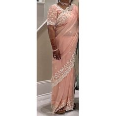 Good Condition, Worn Just Once. Modern Pastel Peach Saree With White Dana Moti Work. This Is A Well Made And Heavy Saree, Fit For Weddings, Bridal Wear, Sangeet, Diwali, Mehendi And Haldi. Handmade In India. Fall And Pico Done. Few Markings From Tailor's Chalk. Comes With Petticoat And Blouse. Pre-draped Organza Saree With Pallu, Organza Pre-draped Saree With Pallu, Designer Wear Pre-draped Organza Saree, Designer Organza Pre-draped Saree, Bollywood Style Organza Pre-draped Saree, Organza Blouse With Traditional Drape, Organza Blouse Piece With Dori Work, Organza Blouse With Dori Work, Traditional Peach Pre-draped Saree For Festive Occasions