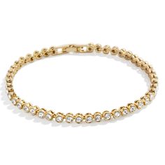 PRICES MAY VARY. Perfect For Stacking - This eternity-style Bracelet makes for an easy addition to your already-curated wrist stack. This gold and crystal band features a lineup of beautiful bezel stones and stacks perfectly with other bracelet styles. High Quality & Safe for Sensitive Skin - Made with hypoallergenic high quality, 18k gold-plated brass, our Amalie Tennis Bracelet is a durable, long-lasting piece of jewelry that is safe for sensitive skin, people with allergies, and won't turn yo Stacking Tennis Bracelets, Gold Stackable Crystal Bracelet, Gold Stackable Crystal Bracelet For Everyday, Stackable Gold Crystal Bracelet For Everyday, Everyday Stackable Gold Crystal Bracelet, Enewton Bracelets Stacks, Luxury Bracelet Stack, Wrist Stack, Gold Tennis Bracelet