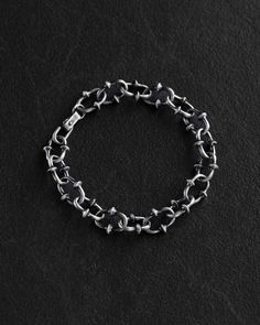 Made from high-quality silver, this exquisite RIKUR bracelet boasts a sleek and stylish design with a width of 1.25 cm. Elevate your accessory game with this elegant piece that combines sophistication with modernity. Perfect for both everyday wear and special occasions, this bracelet is a versatile addition to your collection. Add a touch of luxury to your ensemble with the RIKUR Silver Bracelet. Sizing Guide Please take a moment to measure your wrist before ordering (See photo with how to proce Mens Bracelets Silver, Black Sterling Silver Chain Bracelet, Silver Stainless Steel Bracelets With Hook And Links, Mens Silver Bracelets, Bracelet For Men Silver, Male Bracelets, Mens Accessories Bracelet, Mens Chain, Classic Bangles