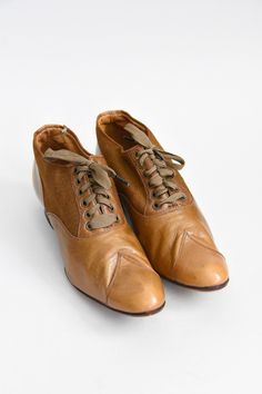 "Antique Edwardian (early) era leather walking shoes. Camel colored leather mixed with canvas. Rounded toe with stitching detail. Wooden heel. Front lace ties. A wonderful representation of attention to detail and lasting craftsmanship. State of garment | very good for age, minimal wear on soles. small repair on left shoe, refer to photos. Measurements ✂--- best fit | Modern 5 1/2 N - 6 N * please refer to measurements below length | 9.5\" width | 2.75\" label | 3 1/2 E ★★Visit The Shop★★ http:/ Vintage Lace-up Boots With Brogue Detailing, Vintage Brown Lace-up Shoes With Rubber Sole, Retro Brown Leather Lace-up Shoes, Vintage Wingtip Leather Shoes For Fall, Vintage Lace-up Shoes With Brogue Detailing And Pointed Toe, Vintage Leather Shoes With Pointed Toe For Fall, Brown Closed Toe Lace-up Shoes With Leather Lining, Vintage Wingtip Lace-up Shoes, Vintage Brown Lace-up Shoes With Brogue Detailing