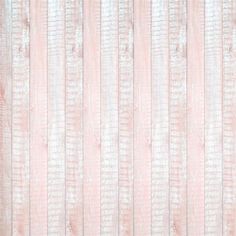 an old pink wallpaper with vertical stripes and faded paint on the wood paneling