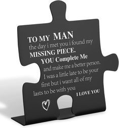 a black puzzle piece with the words to my man on it and a missing piece