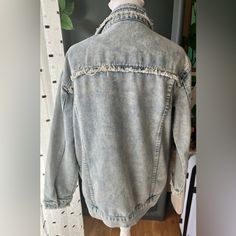 New Without Tag Over Size Distress Denim Jacket. Measurements From Shoulder Across Is 19 Inches From Shoulder To Bottom 23 Inches Long, Arms From Shoulder Down Is 22 Inches In Length. Spring Acid Wash Denim Jacket With Frayed Hem, Spring Acid Wash Outerwear With Frayed Hem, Trendy Washed Denim Blue Jacket, Trendy Washed Denim Jacket, Casual Acid Wash Outerwear With Frayed Hem, Relaxed Fit Light Wash Denim Jacket With Frayed Hem, Dark Wash Denim Top With Frayed Hem, Relaxed Fit Medium Wash Denim Jacket With Frayed Hem, Trendy Washed Denim Top