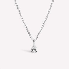 Drape sophisticated women in elegance with our Solo Pear Necklace – a pinnacle of refinement. A single, dazzling gem captivates with brilliance, ensuring a look of unparalleled allure. Metal: 14K Gold Vermeil Pendant dimensions: 3.3 mm / 0.13" x 6.4 mm / 0.25" Chain Width: 1 mm / 0.04" Stone Type: Joopita® StoneTotal length: 40 cm with extensions from 40 cm to 45 cm (15.75" - 17.72") Weight: 2.5 g Elegant 14k Gold Diamond Necklace With Teardrop Pendant, Elegant Necklace In Diamond White With Lab Grown Diamonds, Elegant Necklace With Lab Grown Diamonds In Diamond White, Elegant Necklace With Diamond Cut Lab Grown Diamonds, Elegant Necklace With Prong Setting And Lab Grown Diamonds, Elegant Silver Solitaire Necklace With Lab Grown Diamond, Elegant Silver Solitaire Necklace With Lab-grown Diamond, Elegant Silver Solitaire Necklace, Elegant Lab Grown Diamond Necklace With Brilliant Cut