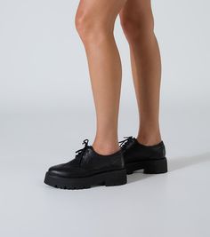 Meet Marni, this leather lace-up features a subtle platform sole and intricate detailing. Finished in our signature black como leather, they are sure to become a new fav. -Material: Leather -Sole: Rubber -Fit: True To Size -Toe-shape: Round -Features: Intricate Detailing -Heel: 5.5cm Black Platform Lace-up Oxfords, Black Leather Platform Lace-up Shoes, Black Leather Brogue Lace-up Shoes, Black Leather Lace-up Shoes With Brogue Detailing, Spring Black Platform Lace-up Shoes, Formal Plain Toe Platform Lace-up Shoes, Low-top Platform Lace-up Shoes For Work, Black Platform Lace-up Shoes With Almond Toe, Platform Lace-up Shoes With Round Toe For Derby