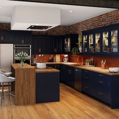 a large kitchen with blue cabinets and wooden floors