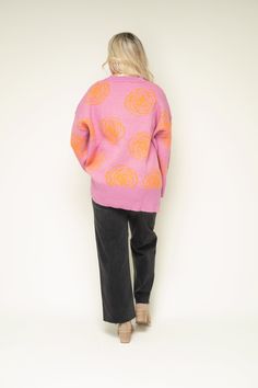 Stay cozy and chic in our Coming Up Roses Oversized Sweater. With a charming color combination of pink and orange flowers, this sweater brings a fun pop to your wardrobe. Exposed seams add a touch of edge, while the oversized fit and wide sleeves provide a comfortable and relaxed feel. Finished with ribbed trim, side slits, and a high/low hem, this sweater offers both style and stretch. Oversized Exposed seams Wide sleeves Ribbed trim Side slits High/low hemline Fit: Relaxed; Generous stretch Bust: Small-48in Medium-50in Large-52in Length: Small-28in Medium-29in Large-30in Fabric: 47% Acrylic 20% Nylon 15% Wool 16% Polyester 3% Spandex Wash Instructions: Hand wash cold; Dry flat Model: She is 5ft 5in and a size 4-6. She is a 36DD and wearing a Medium. Oversized Pink Sweater For Fall, Pink Knit Sweater With Floral Print, Pink Floral Print Sweater For Spring, Pink Sweater For Loungewear In Spring, Pink Sweater For Spring Loungewear, Cozy Pink Sweater In Relaxed Fit, Cozy Pink Relaxed Fit Sweater, Oversized Long Sleeve Sweater With Floral Print, Oversized Long Sleeve Floral Print Sweater