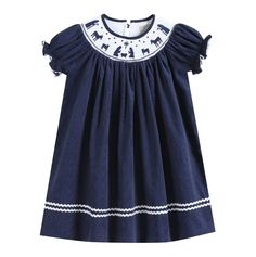 Navy Blue Corduroy Nativity Smocked Bishop Dress Charming and cute! Your little cuties closet is not complete without this adorable outfit. They will love spending their days in this outfit made out of 100% soft cotton. Cute details make it a one of a kind addition to their closet. This Bishop dress is the traditional length with hemline reaching the calf/ankle. From festive activities or just fun days at home your little sweetie will be ready and picture perfect! -100% Cotton -Machine Wash -Man Cotton Smocked Dress With Ruffles For Playtime, Playful Cotton Dress With Smocked Bodice, Cotton Dress With Smocked Back For Playdate, Playful Cotton Smocked Playtime Dress, Cotton Smocked Dress For Playtime, Playful Cotton Smocked Dress With Short Sleeves, Cotton Dresses With Smocked Cuffs For Playtime, Blue Casual Cotton Smocked Dress, Casual Blue Cotton Smocked Dress