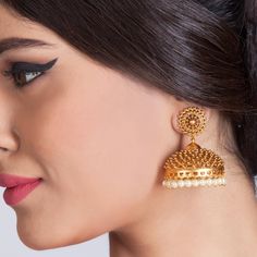 Matar Jhumka Earrings are encrusted with an amazing antique-gold plated brass work that truly make these earrings become of their own. These are as majestic and royal as the ancient Indian palaces. Each piece is handcrafted and made to orders. All the raw material used in this product is of high quality and is handcrafted with love. Specifications: Weight 40 gm; Earrings Length: 5 cm 100% Satisfaction Guarantee: 1 Year Warranty, Long Lasting Plating, High-Quality Stones. Gifting: This pair of ch Jhumka Designs, Gold Jhumka, Gold Jhumka Earrings, Gold Hoop Earring, Indian Jewelry Earrings, Gold Necklace Indian, Indian Jewellery Design Earrings, Necklace Indian, Gold Ring Designs