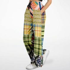 Introducing the Ginger Snap Boho Patchwork Eco-Poly Wide Leg Pants – a vibrant and stylish addition to your wardrobe. These eye-catching pants feature an eclectic mix of colorful patterns, perfect for making a bold statement. Made from durable Eco-Poly fabric, they offer a comfortable and sturdy feel. The elastic drawstring waist provides a customizable fit, while the hidden side seam scoop pockets add practicality without compromising on style. Due to its eclectic pattern and color mix, these p Multicolor Baggy Straight Leg Pants, Spring Patchwork Straight Pants, Multicolor Baggy Straight Leg Bottoms, Baggy Multicolor Straight Leg Bottoms, Spring Patchwork Pants, Multicolor Relaxed Fit Trousers, Bohemian Multicolor Straight Leg Bottoms, Baggy Multicolor Wide-leg Pants, Baggy Wide Leg Multicolor Pants