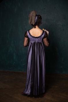 Exquisite half-mourning Regency gown, or just evening dress with modest tulle embelishments. The dress consists of two layers. The underlayer is gentle purple colour satin (100% cotton) and the outer layer is black tulle. The sleeves and decoration elements are made of tulle too. The bottom line is decorated with black cord. The bodice of the dress closes on back. The decolette line and empire waist line are adjustable due to the drawstring. The in stock dress will best fit for the following mea Elegant Purple Organza Gown, Elegant Purple Gown For Debutante Ball, Evening Gown In Purple Organza, Purple Organza Evening Dress For Debutante Ball, Evening Purple Organza Gown, Evening Organza Gown In Purple, Elegant Victorian Evening Dress In Satin, Elegant Victorian Dress In Satin For Evening, Elegant Victorian Satin Dress For Evening