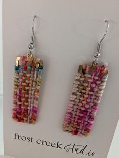 the earrings are made out of woven material