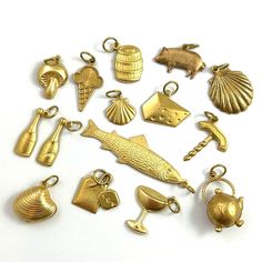 Food & Beverage Themed Charms -Quantity: 1 Charm -Choose your charm from the drop down menu -Mix of vintage and modern brass charms -These also make a fun little gift for someone special! ITEM DESCRIPTION For this choose a charm listing, I went with a food and beverage theme!  The charms are a mix of vintage and modern, all brass metal. Many are stampings (slightly dimentional on the front and hollow on the back), a few are puffy (double sided and hollow on the inside), and the rest have a flat Themed Gold Jewelry For Party, Gold Themed Charm Bracelet, Themed Charm Jewelry For Birthday, Themed Gold Charm Bracelet, Novelty Gold Jewelry For Birthday, Gold Novelty Jewelry For Birthday, Themed Birthday Jewelry With Charms, Gold Novelty Charm Necklaces For Gifts, Gold Novelty Charm Necklace For Gifts