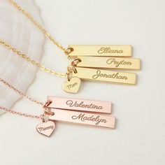 "Select 1-5 bars, each engraved with her children's names completed with a small \"Grandma\" or Nana\" heart depending on your choice. What is an adorable present for nana and grandma to share the love with their loved one! ★ GRANDMA BAR TAG NECKLACE WITH KIDS NAMES * Bar measures approx. 1 1/4\" x 1/4\" (32 x 6.5mm). Heart charm approx. 0.37\" x 0.32\" (9.5 x 8.2mm) * Word limits: 1-2 words/side (10 character/name) * By default, silver item comes with BLACK engraving and gold-plated item comes with CLEAR engraving * All of our jewelry are handmade from scratch and packaged with care in our workshop ★ HOW TO ORDER & ADD PERSONALIZATION - Select your preferred color, number of the bar tags (up to 3 bars) and necklace length from the menu. - Include in the \"Add your personalization\" box th Mother's Day Engraved Nameplate Charm Necklace, Personalized Nameplate Charm Necklace For Birthday, Engraved Charm Necklace For Birthday And Mother's Day, Engraved Charm Necklaces For Birthday And Mother's Day, Rectangular Engraved Name Necklace For Mother's Day, Personalized Rectangular Necklaces For Birthday, Personalized Rectangular Necklace For Birthday, Engraved Adjustable Name Necklace For Birthday, Adjustable Engraved Name Necklace For Birthday