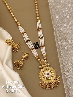 Description :- South Indian Necklace Set Bollywood Necklace Earring Set Ethnic Gold Plated Indian Wedding Jewelry Party Wear Necklace Set Gift yourself a royal look with this perfectly crafted necklace set from Manalisstudio. Crafted with high quality CZ stones, it is impressive in design. The green enamel artwork adds perfect texture to the design. Perfect for weddings and festivities, this antique necklace set should be put on with your favorite sari or lehenga. 100% Satisfaction. Long Lasting Long Necklace Designs, Bollywood Necklace, South Indian Necklace, Gold Neck Chain, Antique Necklace Set, Indian Necklace Set, Long Necklace Set, Phone Wallpaper Pink, Indian Necklace